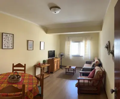 a living room with a couch and a table at CENTER HOUSE in Faro