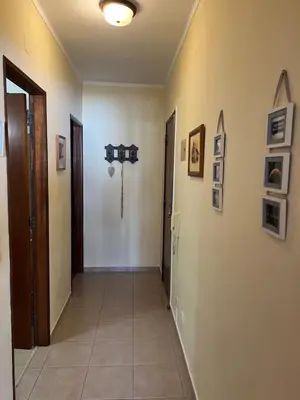 a hallway with a door and a tile floor at CENTER HOUSE in Faro