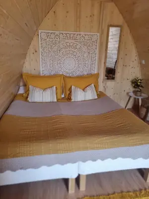 a bedroom with a large bed in a room at Eco Cabin - Villa das Alfarrobas in Algoz