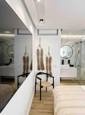 a room with a store with vases on the wall at Front Sea Apartment Albufeira in Albufeira