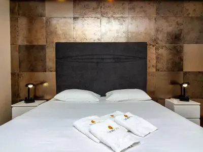 a bed with two towels on top of it at Dunas Salgados Apartment by Stay ici Algarve Holiday Rental in Albufeira