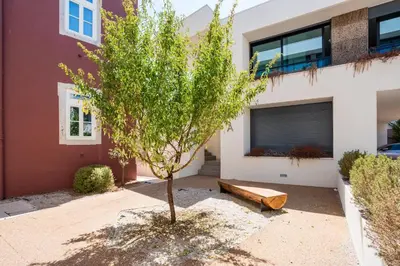 a small tree in front of a house at Diamond Downtown Center in Faro