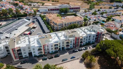 an aerial view of a city with buildings and cars at Luminous 2 BDR Apartment W/Pool by LovelyStay in Albufeira