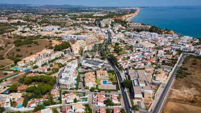an aerial view of a city next to the ocean at Luminous 2 BDR Apartment W/Pool by LovelyStay in Albufeira
