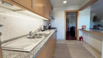 a kitchen with two sinks and a counter top at Albufeira Oasis Retreat in Albufeira