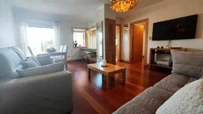 a living room with a couch and a table at Albufeira Oasis Retreat in Albufeira