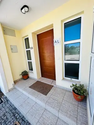 a front door of a house with plants at Ferreiras Villa in Albufeira