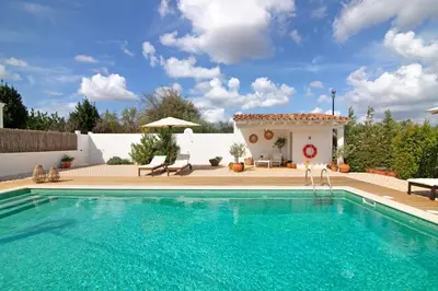 a swimming pool in front of a villa at Casa de Benafim 1 in Benafim