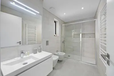 a bathroom with a sink and a toilet and a shower at Terracos de Quarteira II Yellow by Real Properties in Quarteira