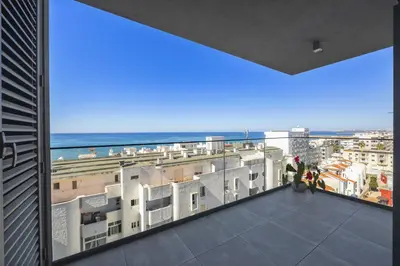 a view of the ocean from the balcony of a building at Terracos de Quarteira II Yellow by Real Properties in Quarteira