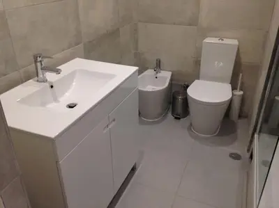 a bathroom with a sink and a toilet at CASA Vila Magna T0 in Albufeira