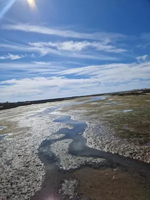 a large body of water with rocks and water at Sleep and Fly in Faro