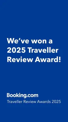 a blue sign that says weve won a traveler review award at B&B Casa Flamenga in Alte