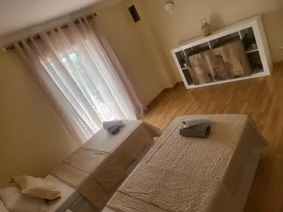 a bedroom with two beds and a window at Flor do Campo in Albufeira