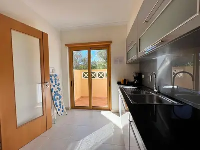 a kitchen with a sink and a counter top at Villa Durban in Albufeira