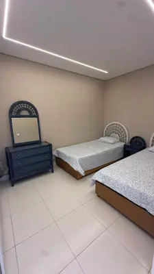a bedroom with two beds and a mirror in it at Tivoli AP Casino Vilamoura in Vilamoura