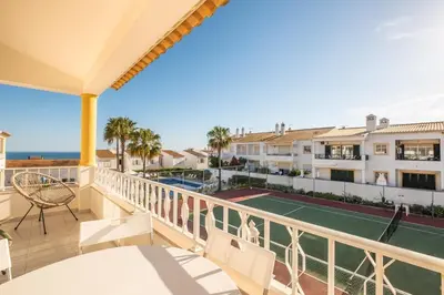 a view from the balcony of a house with a tennis court at Sweet Home Arrifes in Albufeira