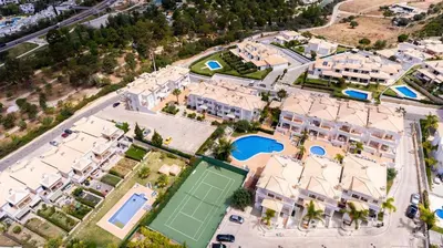 an aerial view of a resort with a tennis court at Thiago Holidays Apartment in Albufeira