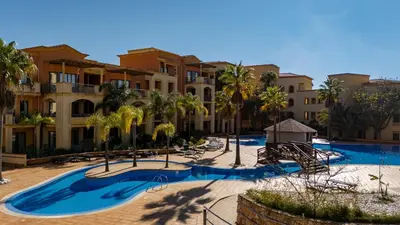 a resort with a swimming pool with a playground at Greice Homes- 3 bed Luxury Apartment in Vilamoura in Quarteira
