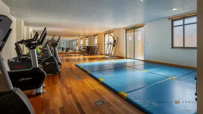 a fitness room with a gym with treadmills at Greice Homes- 3 bed Luxury Apartment in Vilamoura in Quarteira