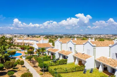 an aerial view of a villa with a resort at Gale SunBeach Village - Jardins da Gale in Albufeira