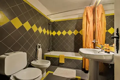 a bathroom with a toilet and a sink at Villa Jonas in Albufeira
