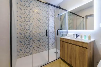 a bathroom with a shower and a sink at Atlantic Bliss in Albufeira