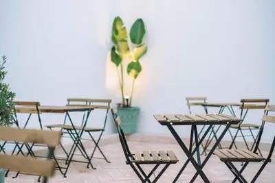 a group of tables and chairs in a room at Atlantic Bliss in Albufeira