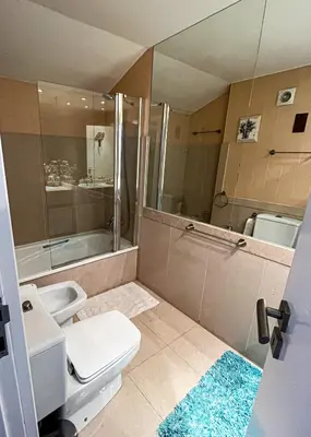 a bathroom with a toilet and a sink and a tub at Carpe Diem Vilamoura By Dualhotels in Vilamoura