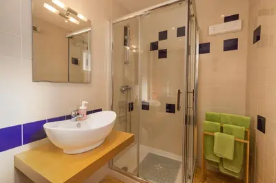 a bathroom with a sink and a shower at Apartamentos Pescadores in Albufeira