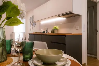 a kitchen with a table with a bowl on it at Carmo House in Faro