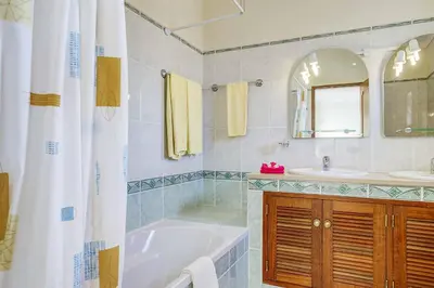 a bathroom with a tub and a sink at Villa Jeanic in Galé