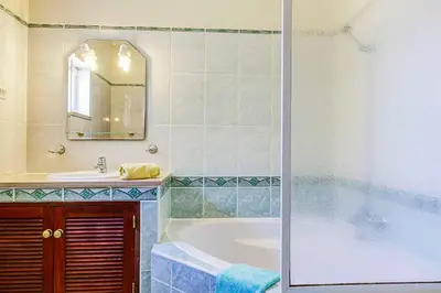 a bathroom with a tub and a sink at Villa Jeanic in Galé