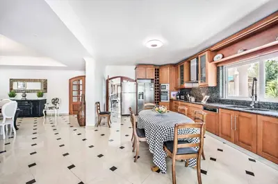 a kitchen and dining room with a table and chairs at Villa Paris in Terras Novas