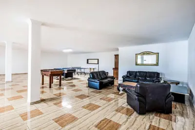 a living room with couches and a pool table at Villa Paris in Terras Novas