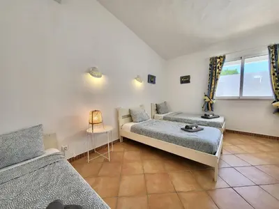 a bedroom with two beds and a window at Albufeira Quinta da Balaia Charming by Homing in Albufeira
