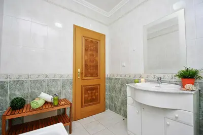 a bathroom with a sink and a mirror at Apartment Ipanema 2 by Algarve Vacation in Albufeira