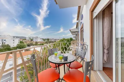 a balcony with a table and chairs with a view at Peaceful 1 BDR Apartment W/ Balcony by LovelyStay in Almancil