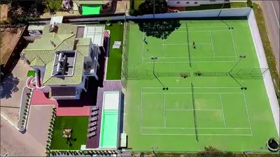 an aerial view of a tennis court at Villa | w/ Private Pool, Tennis Courts & Golf Putt in Vilamoura
