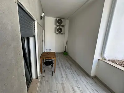 a room with a table and a chair in a room at CASA ANALUCIA in Faro