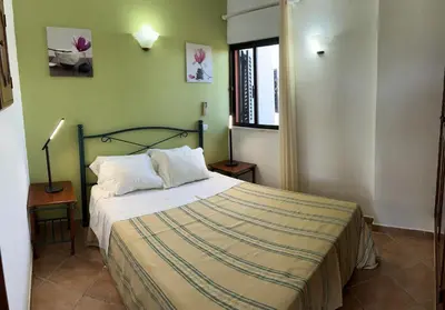 a bedroom with a bed and a window at Casa da Horta, Vale carro Olhos de Agua in Albufeira