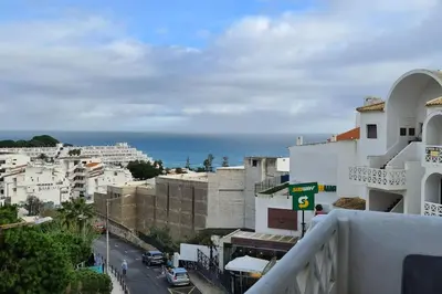 a view of a city with buildings and the ocean at 403 - Oura - 2 bedroom- Sea View in Albufeira