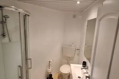 a bathroom with a shower and a toilet and a sink at 403 - Oura - 2 bedroom- Sea View in Albufeira