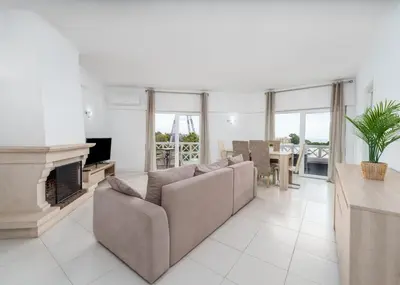 a living room with a couch and a fireplace at 403 - Oura - 2 bedroom- Sea View in Albufeira