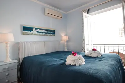 two stuffed animals are sitting on a bed at Two bed Old Village E007 in Vilamoura
