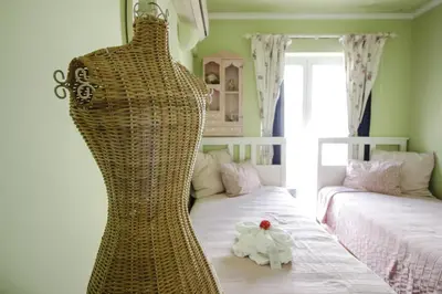 a dress hanging on a bed in a room at Two bed Old Village E007 in Vilamoura