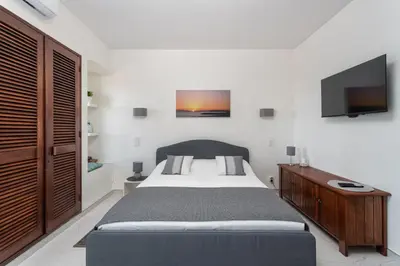 a bathroom with a washing machine in a shower at BnB Homes Jardim Cozy Apartment with 3 Swimming pools near the Old Town in Albufeira