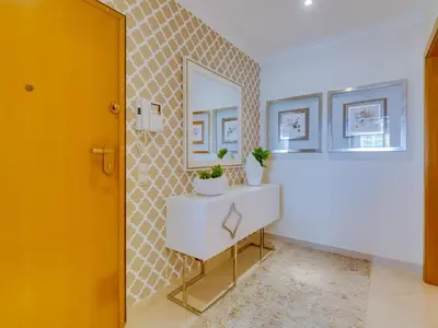 a bathroom with a white sink and a mirror at AL - Apartamento Moura Praia in Vilamoura