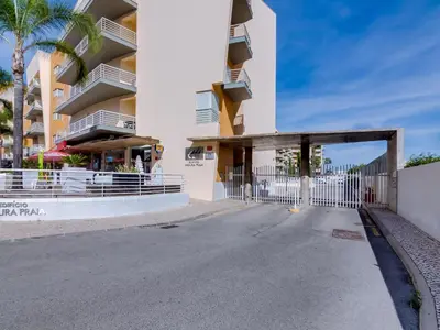 an empty street in front of a building at AL - Apartamento Moura Praia in Vilamoura