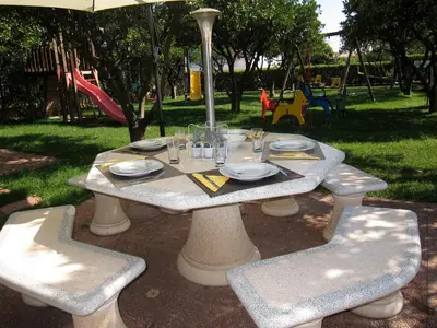 a table and chairs with plates and glasses on it at CH 1 e 2 Two Apartments Up To 10 Guests Casa da Horta, T1 & T2 in Albufeira